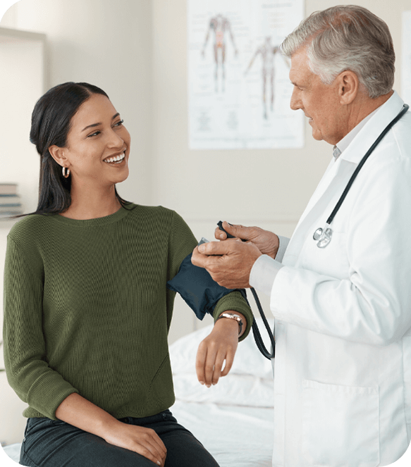 Doctor checking blood pressure during urgent care